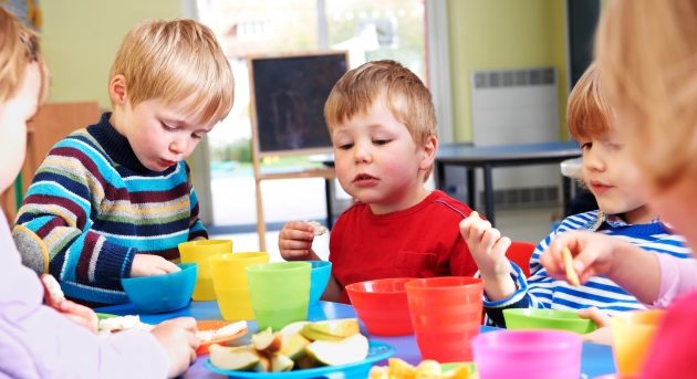 Pre School Children Eating Healthy Snacks At Breaktime Pre School Children Eating Healthy Snacks At Breaktime